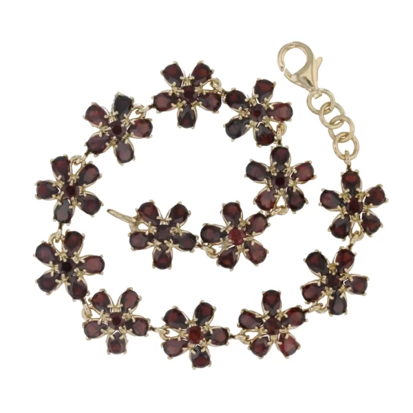 Vintage Goldkette mit roten Granatsteinen im Kreisgelegt damit man alle Elemente sieht.